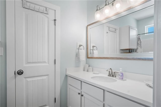 bathroom with vanity and a shower with shower curtain