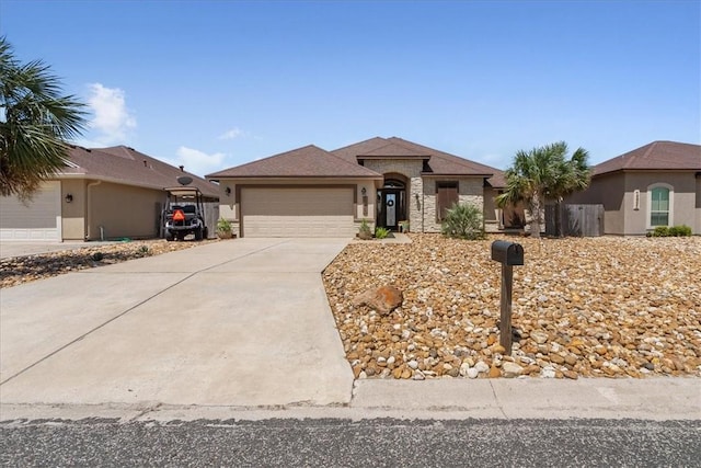 15825 Cozumel Dr, Corpus Christi, TX 78418 - view of front facade featuring a garage and driveway