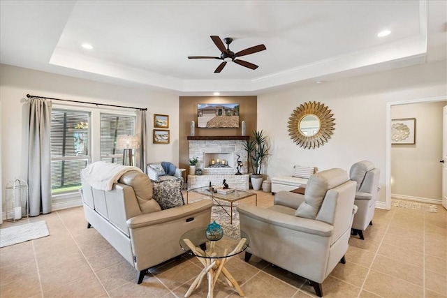 15825 Cozumel Dr, Corpus Christi, TX 78418 - living area with a raised ceiling, ceiling fan, light tile patterned floors, recessed lighting, and a fireplace