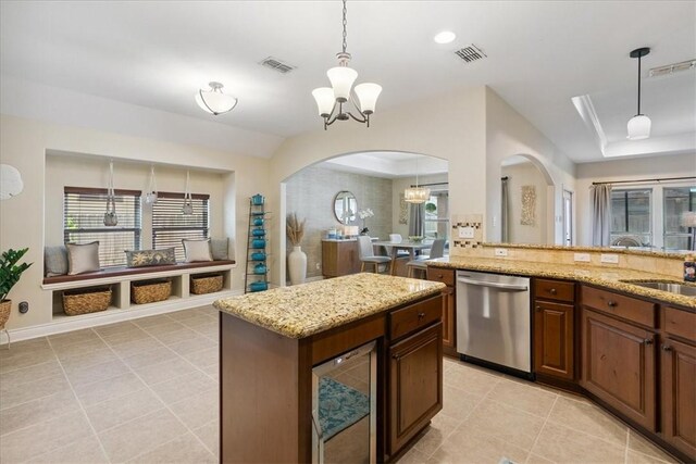 15825 Cozumel Dr, Corpus Christi, TX 78418 - kitchen with dishwasher, a chandelier, light tile patterned floors, and light stone countertops