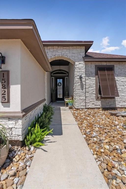 15825 Cozumel Dr, Corpus Christi, TX 78418 - view of exterior entry featuring stone siding and stucco siding