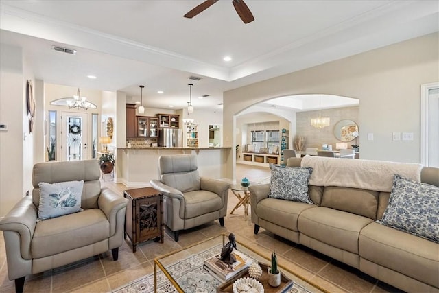 15825 Cozumel Dr, Corpus Christi, TX 78418 - living room featuring a chandelier, a ceiling fan, light tile patterned floors, arched walkways, and recessed lighting