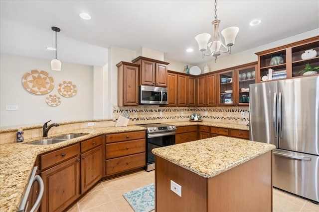 15825 Cozumel Dr, Corpus Christi, TX 78418 - kitchen with stainless steel appliances, tasteful backsplash, light stone counters, a chandelier, and recessed lighting