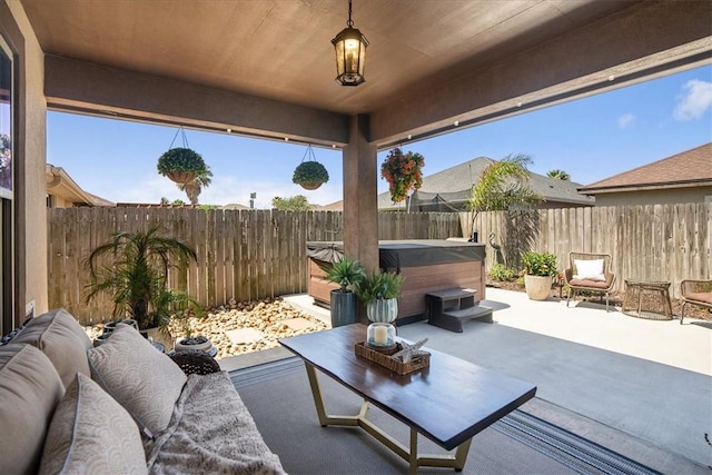 15825 Cozumel Dr, Corpus Christi, TX 78418 - fenced backyard with a hot tub, a patio, and an outdoor hangout area