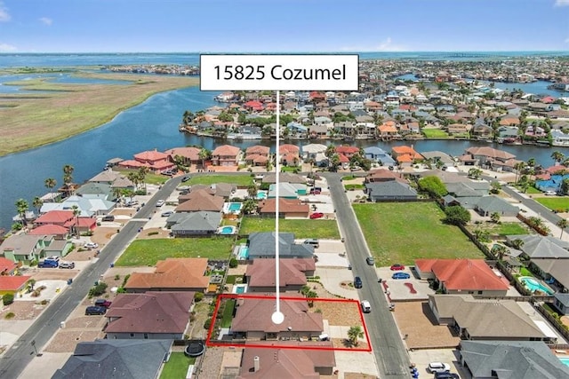15825 Cozumel Dr, Corpus Christi, TX 78418 - aerial view of residential area with property boundaries highlighted and a large body of water