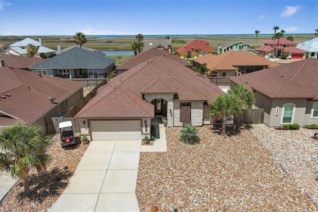 15825 Cozumel Dr, Corpus Christi, TX 78418 - view of front of house featuring driveway, a residential view, and an attached garage