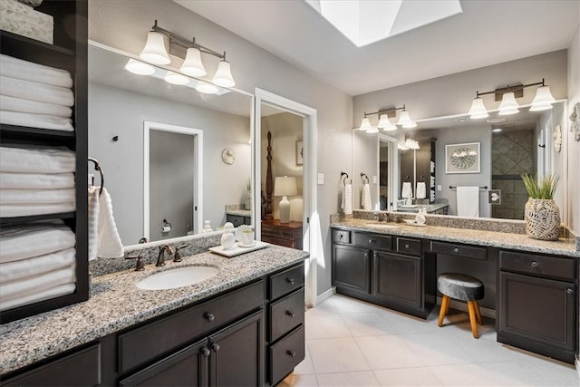 15825 Cozumel Dr, Corpus Christi, TX 78418 - full bathroom with two vanities, tile patterned floors, and a tile shower
