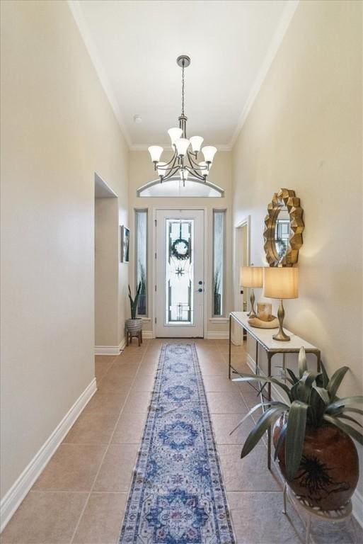 15825 Cozumel Dr, Corpus Christi, TX 78418 - foyer entrance with a chandelier, light tile patterned flooring, and ornamental molding