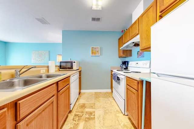 kitchen with white appliances and sink