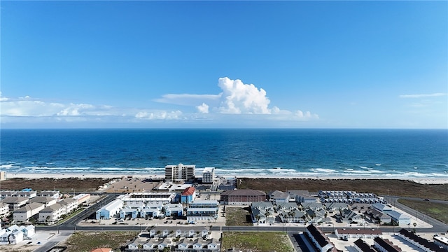 drone / aerial view featuring a water view and a beach view