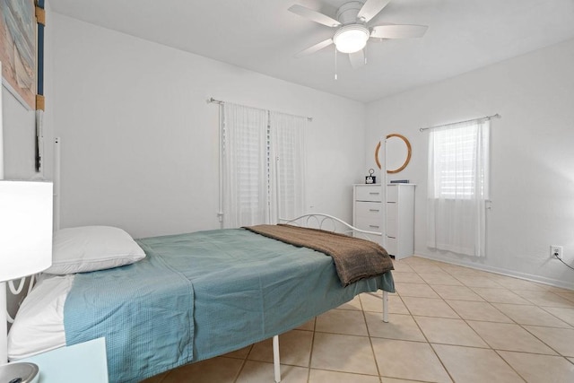 bedroom featuring light tile patterned floors and ceiling fan