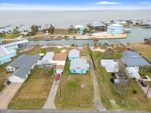 bird's eye view with a water view and a residential view