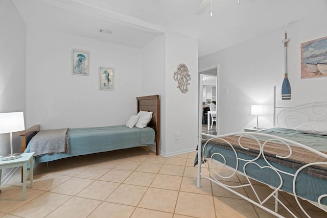 bedroom with light tile patterned floors, baseboards, visible vents, and a ceiling fan