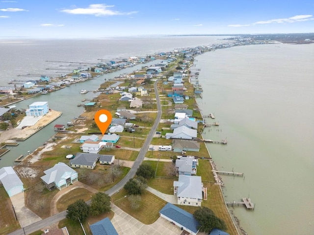 bird's eye view with a water view and a residential view