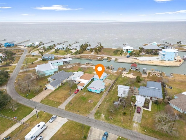 birds eye view of property with a residential view and a water view