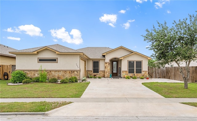 7622 Neches Dr, Corpus Christi, TX 78414 - view of front of house featuring stone siding, stucco siding, and concrete driveway