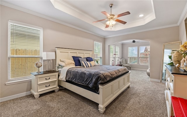 7622 Neches Dr, Corpus Christi, TX 78414 - bedroom with carpet, a raised ceiling, crown molding, baseboards, and arched walkways