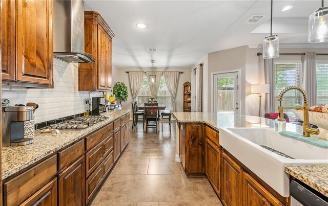 7622 Neches Dr, Corpus Christi, TX 78414 - kitchen with wall chimney range hood, a sink, stainless steel appliances, plenty of natural light, and recessed lighting