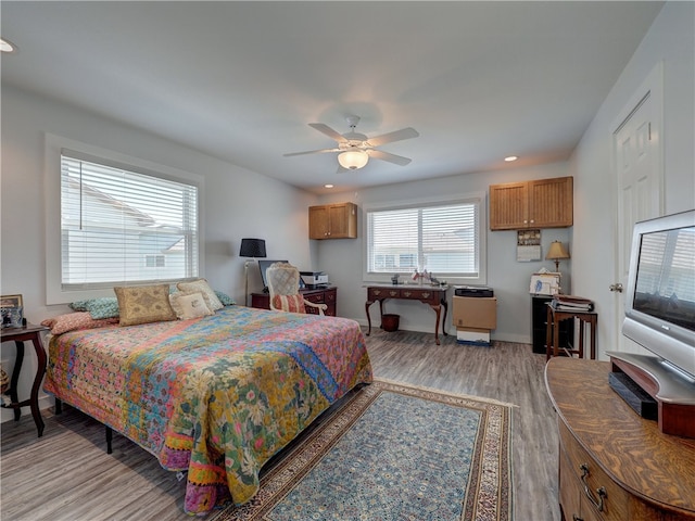 bedroom featuring light hardwood / wood-style floors and ceiling fan