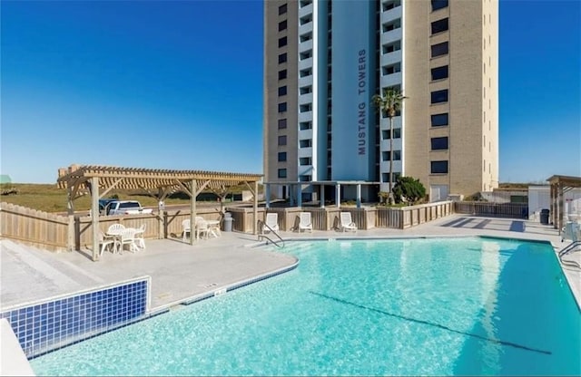 view of swimming pool featuring a pergola and a patio area