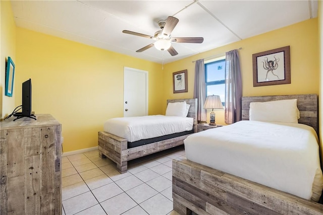 tiled bedroom featuring ceiling fan