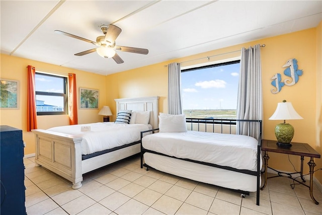 tiled bedroom with ceiling fan