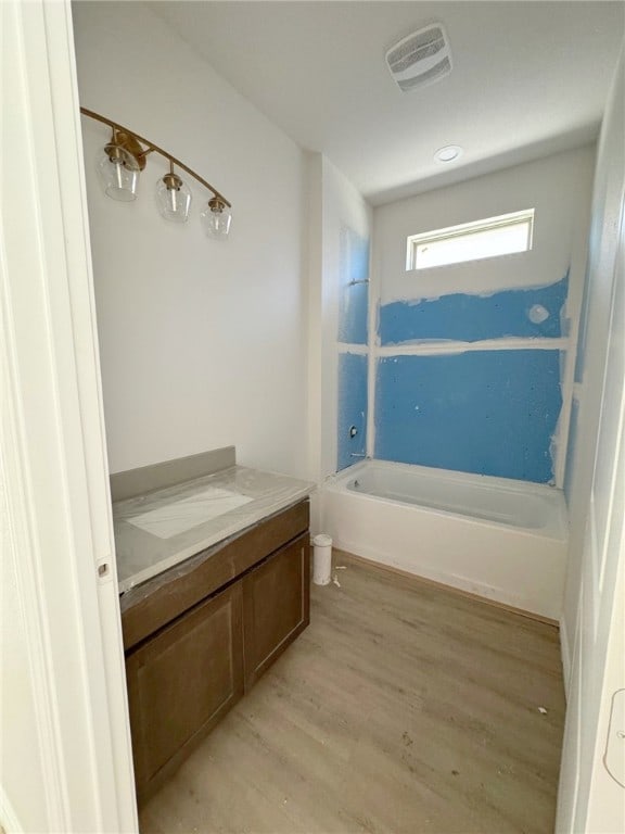 bathroom featuring hardwood / wood-style floors and vanity