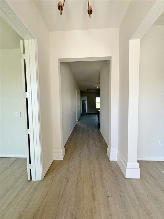 hall with light hardwood / wood-style floors