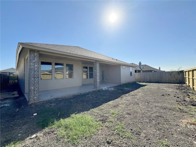 back of property with a patio area