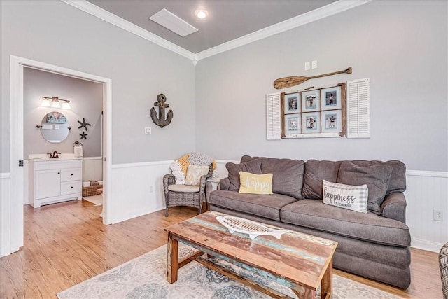 77 Augusta Cir, Aransas Pass, TX 78336 - living area with light wood-style flooring, ornamental molding, and wainscoting