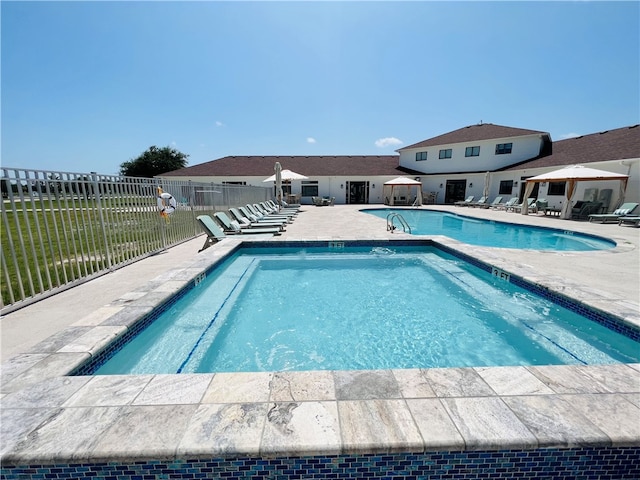 view of swimming pool with a patio area