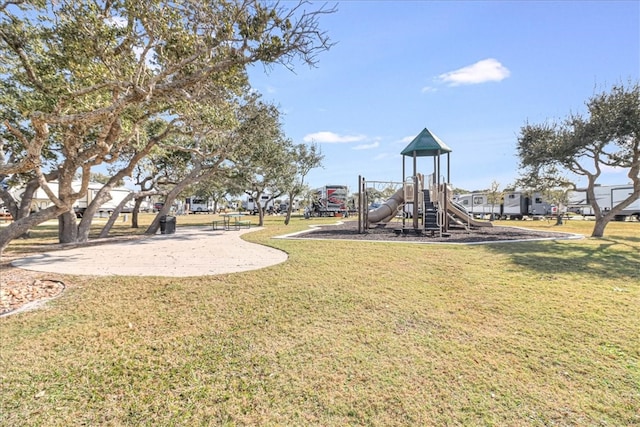 view of playground featuring a lawn