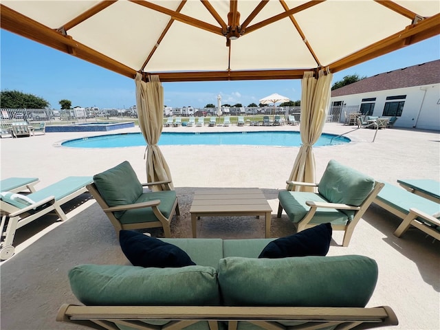 view of pool featuring a gazebo and a patio area