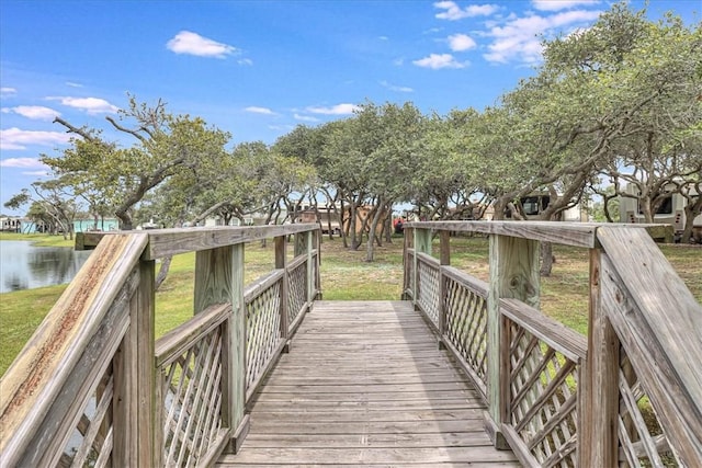 77 Augusta Cir, Aransas Pass, TX 78336 - wooden terrace with a water view and a lawn