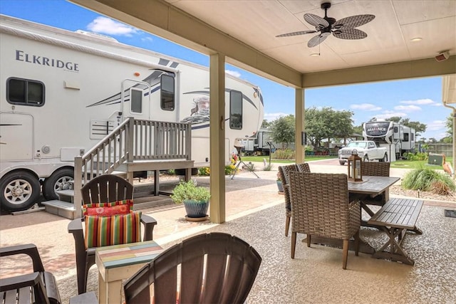 77 Augusta Cir, Aransas Pass, TX 78336 - view of patio / terrace with a ceiling fan and outdoor dining area