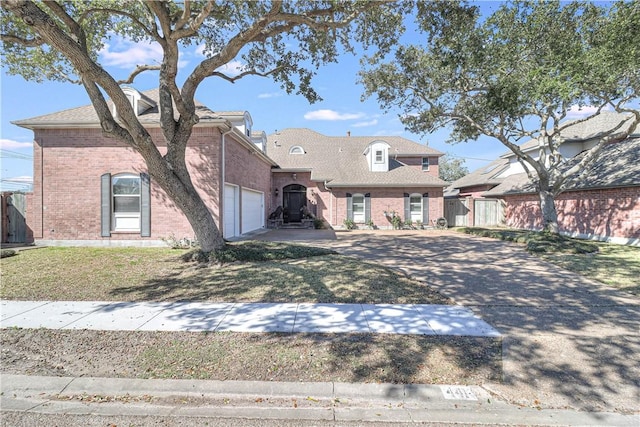 441 Colony Dr, Corpus Christi, TX 78412 - french country style house with brick siding, driveway, and fence