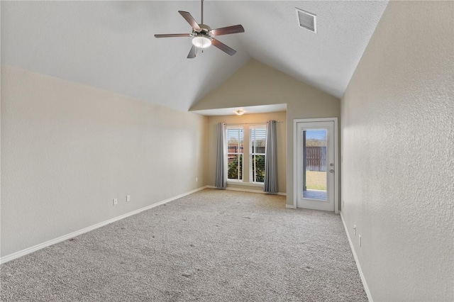 420 Palmer Dr, Portland, TX 78374 - spare room featuring lofted ceiling, a ceiling fan, a textured wall, light carpet, and baseboards