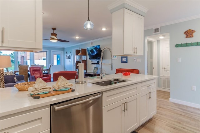 kitchen featuring sink, white cabinets, hanging light fixtures, stainless steel dishwasher, and ceiling fan