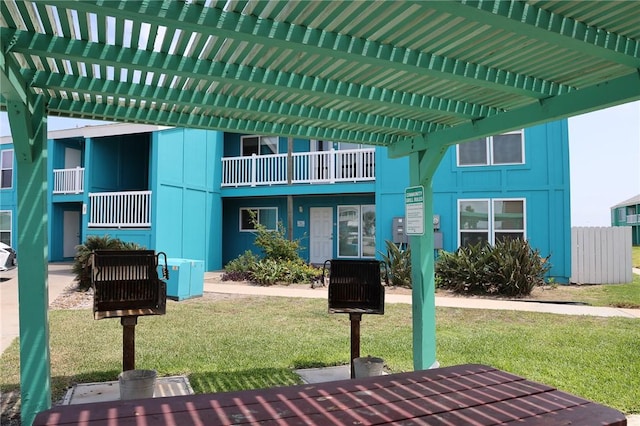 exterior space featuring a yard and a pergola