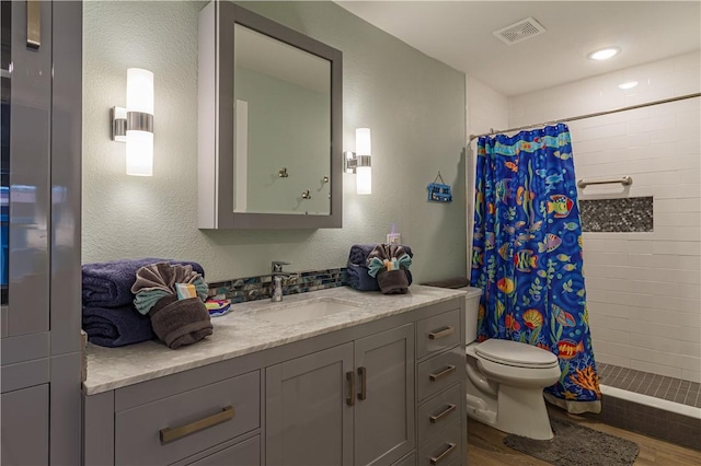 bathroom with vanity, wood-type flooring, toilet, and a shower with shower curtain