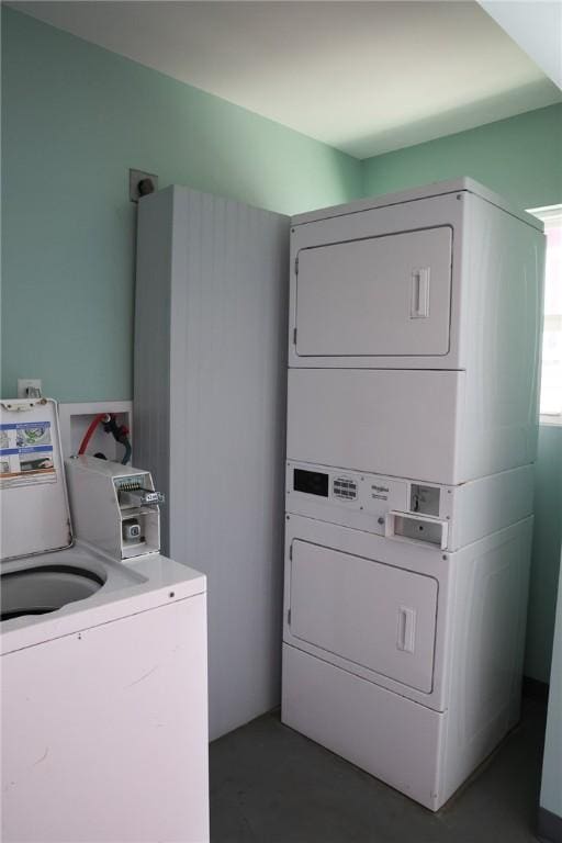 laundry room featuring stacked washing maching and dryer