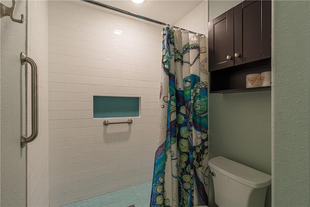 bathroom with toilet and curtained shower