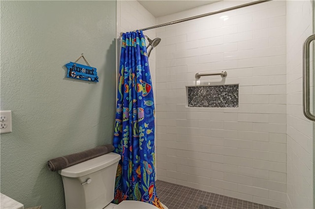 bathroom with walk in shower and toilet