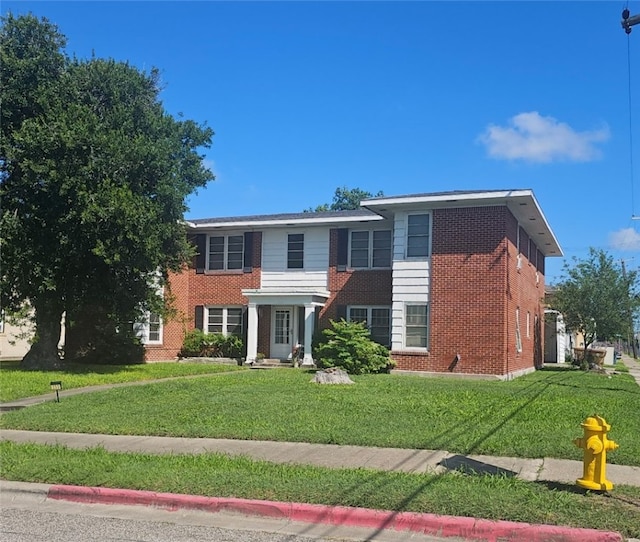 253 Leming Ave, Corpus Christi, TX 78404 - view of front of home featuring a front lawn and brick siding