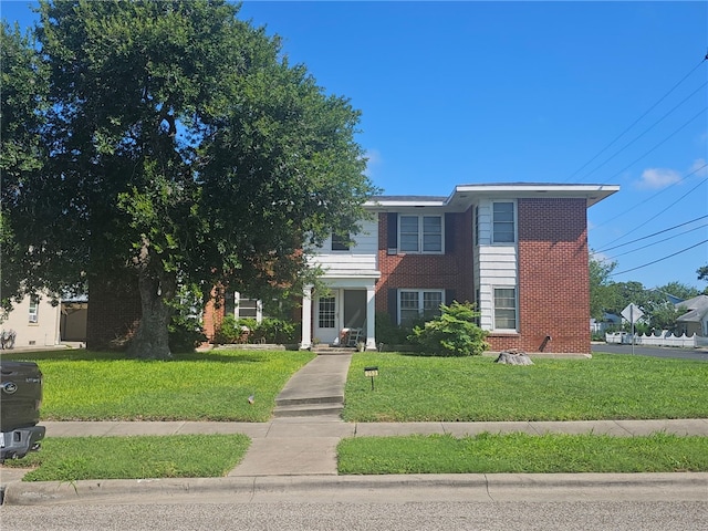 253 Leming Ave, Corpus Christi, TX 78404 - view of front of house with a front yard and brick siding