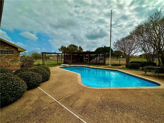 view of pool featuring fence, a diving board, a gazebo, a fenced in pool, and a patio area