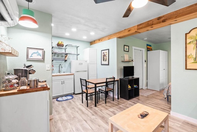 256 Melrose St, Corpus Christi, TX 78404 - dining room with ceiling fan, light wood-type flooring, beamed ceiling, recessed lighting, and an AC wall unit