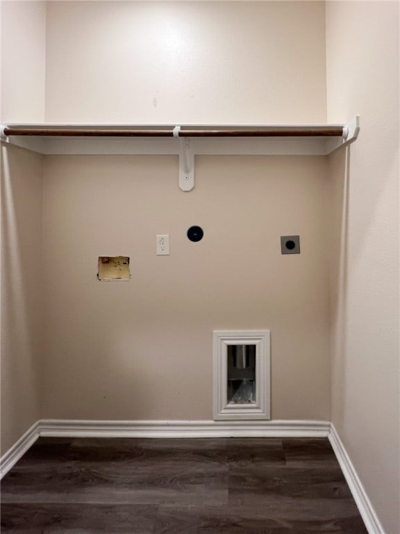 laundry area featuring dark hardwood / wood-style flooring, electric dryer hookup, hookup for a washing machine, and hookup for a gas dryer