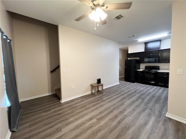 living room with ceiling fan and dark hardwood / wood-style floors