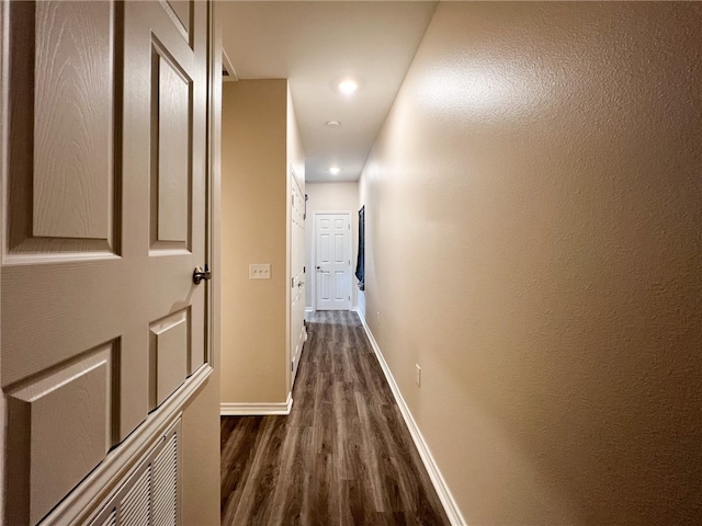 hall featuring dark wood-type flooring